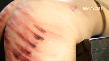 b. caning and whipping action