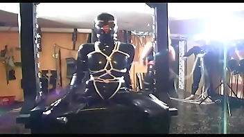 Latex girl tied up by her mistress